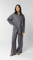 women wearing linen shirt and pants in purple