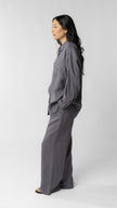 women wearing linen shirt and pants in purple
