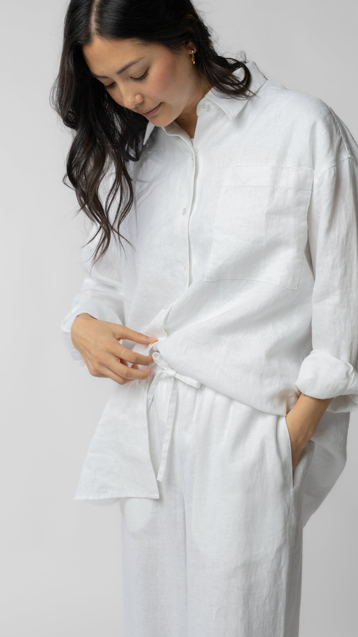 model wearing linen top and pants in white