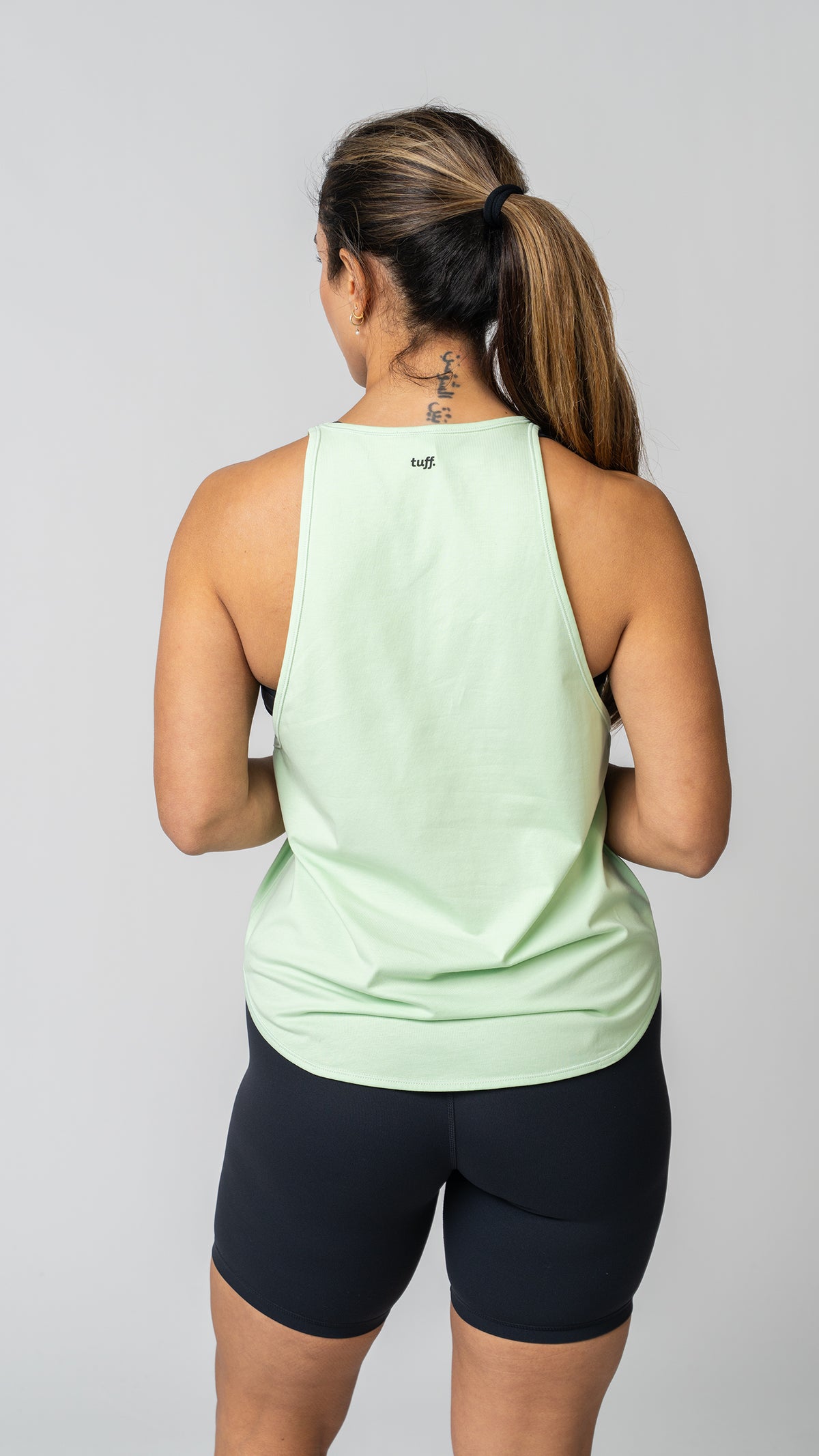 women wearing a green tank top