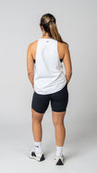 women in a white tank top