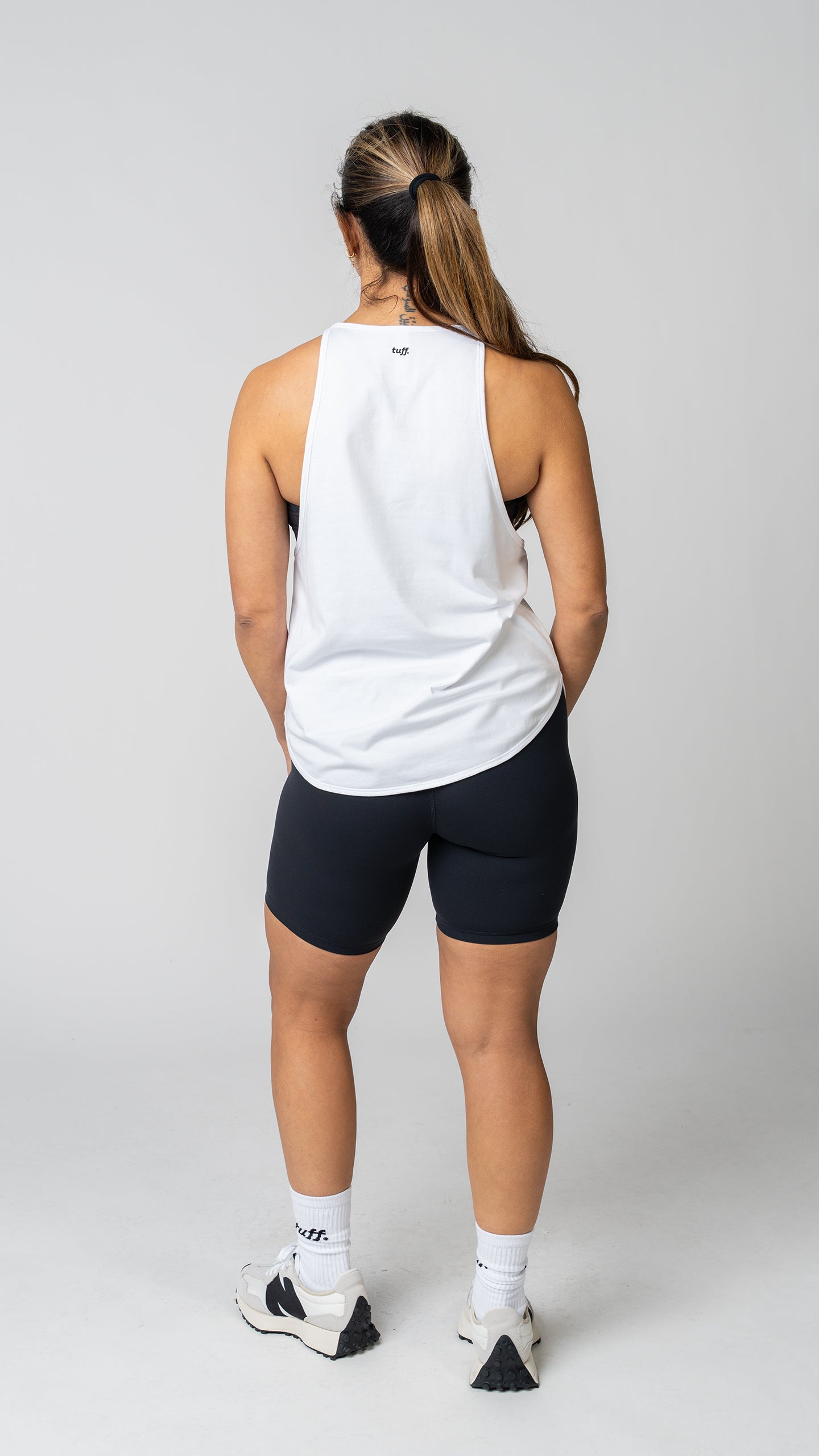 women in a white tank top