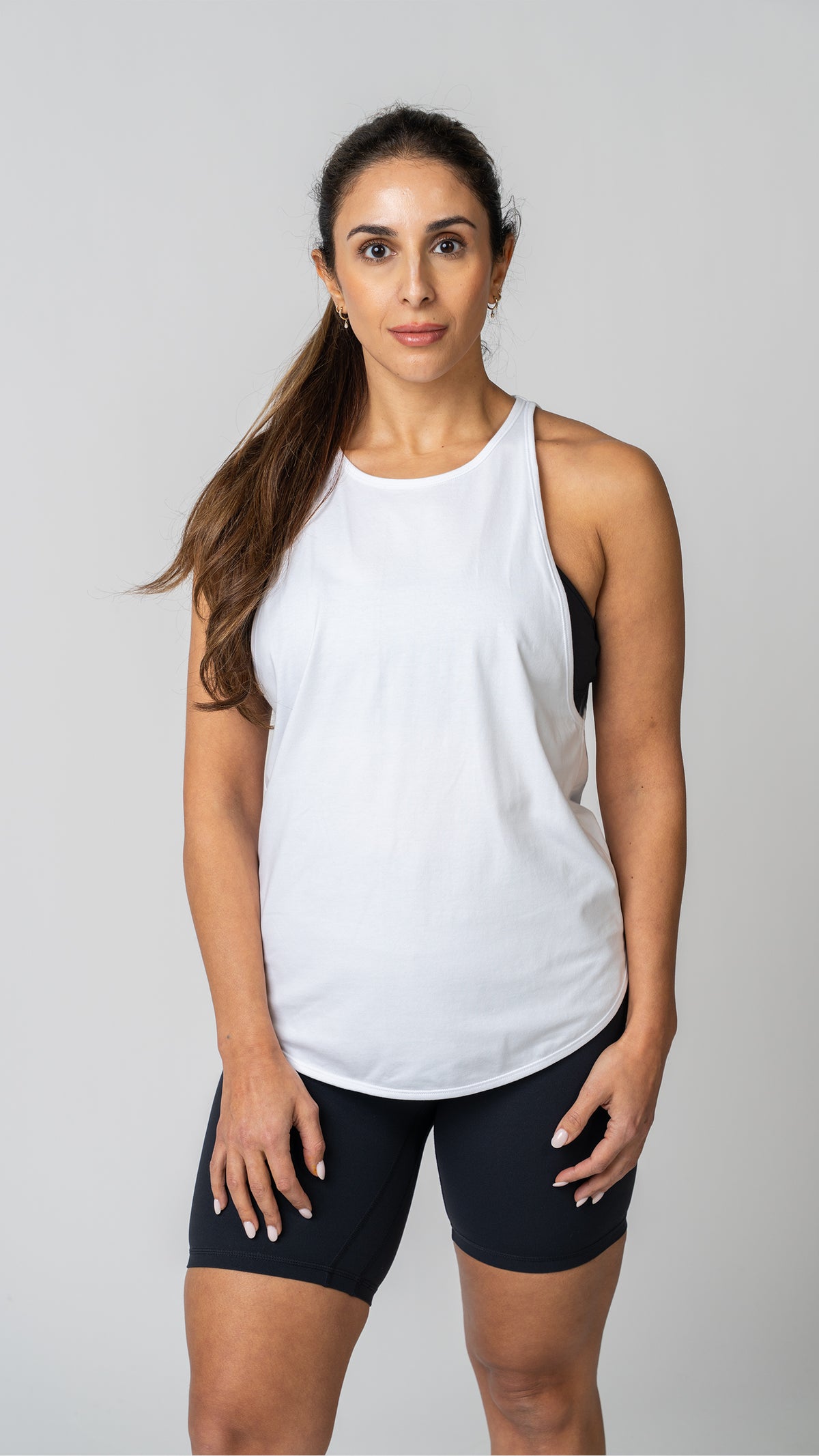 women in a white tank top