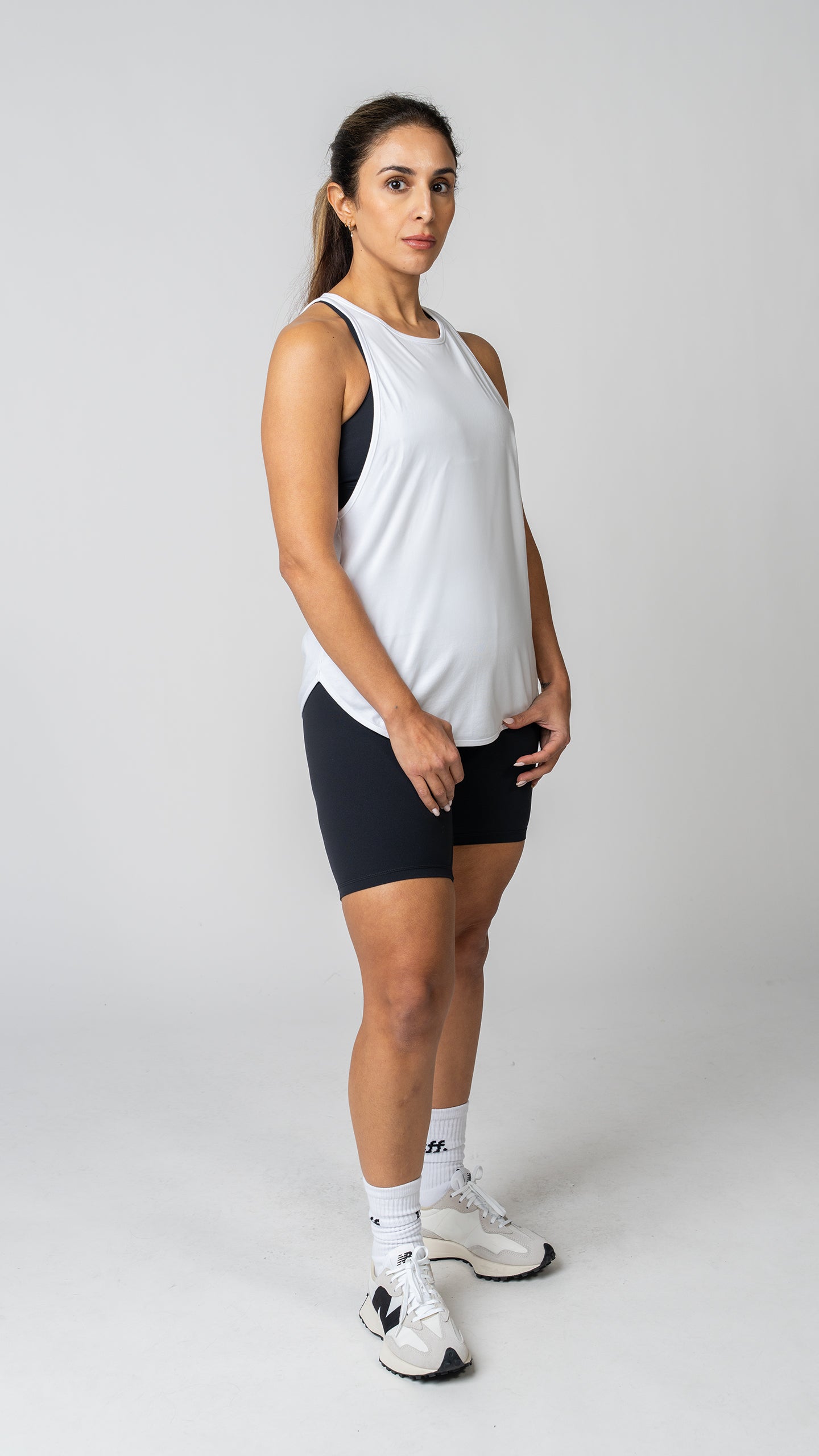 women in a white tank top